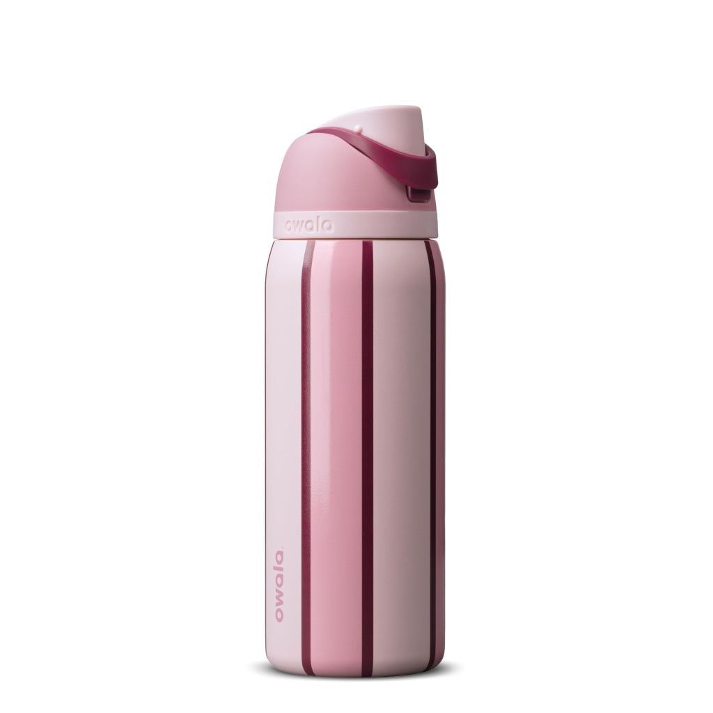 Owala Sweet Talk FreeSip bottle with a soft blush pink body, deep burgundy vertical stripes, pale pink lid, and dark raspberry carry handle.