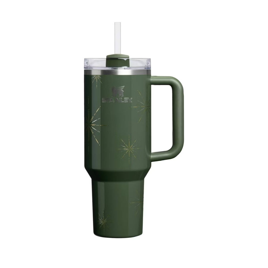 Stanley Pine Winter Radiance dark evergreen tumbler with metallic gold starbursts and matching green handle