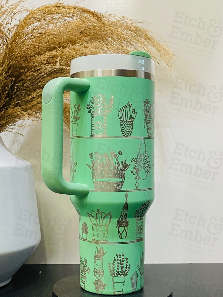 https://etchandember.com/cdn/shop/files/house-plant-custom-stanley-adventure-quencher-40-oz-tumbler-tumblers-559.jpg?v=1684997992&width=1445